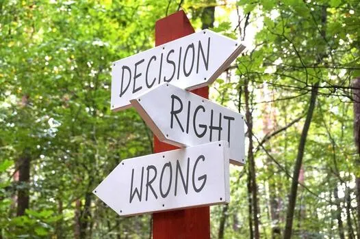 decision-right-wrong-wooden-signpost-with-three-arrows-forest-in-background-photo